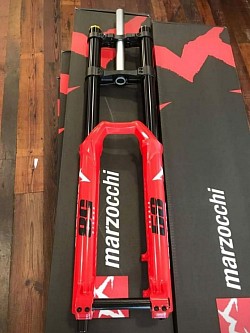 Marzocchi Bomber 58 fork, designed for downhill and bike park riding. Key features include:  Travel: 203mm (8 inches). Stanchions: 40mm, black-anodized aluminum. Damper: GRIP damper for improved traction. Air Spring: Float EVOL air spring. Wheel Size: 27.5 inches. Axle: 20x110mm DH (non-Boost). Construction: Stout build for aggressive riding. Adjustability: Simplified compression and rebound settings. Availability: Also available in black. Manufacturing Location: Since 2008, Marzocchi forks have been manufactured in Taiwan. $500 shipped included