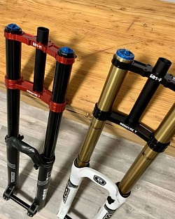 suspension forks for bikes, specifically: Function: Suspension forks absorb bumps and vibrations for a smoother ride. They use a spring and damping system allowing the wheel to move independently.  Components: Forks include an air spring or coil spring, a damper to control motion, uppers (containing the steer tube, crown, and legs), and lowers.  Adjustments: Adjustments can be made for preload (stiffness) and rebound damping (how quickly the fork returns to its original position).  Maintenance: Fork oil should be changed periodically as it degrades over time.  Axle: An axle connects the wheel to help propel and retain the position of the wheels.