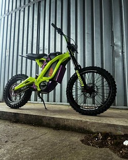 SURRON Light Bee X Electric Bike 2024. Key features include:  Type: Electric dirt bike, blending elements of a mountain bike and a motorcycle. Brand: SURRON. Motor: Electric. Tires: Mitas. Suspension: BOXXER. Range: Approximately 40-80 miles on a single charge, depending on conditions. Speed: Up to 47 mph. Weight: 47kg plus battery. Customization: Features aftermarket parts such as EVF.