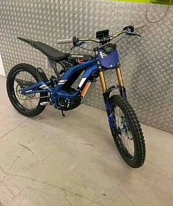 SURRON Light Bee X Electric Bike 2024. Key features include:  Type: Electric dirt bike, blending elements of a mountain bike and a motorcycle. Range: Approximately 40-80 miles on a full charge, depending on conditions. Top Speed: Around 47 mph (73 km/h). Motor: Liquid-cooled, brushless electric motor. Battery: 60V 32A lithium-ion. Weight: 47kg plus battery. Tires: 19-inch spoke wheels with CST tires. Brand: SURRON.