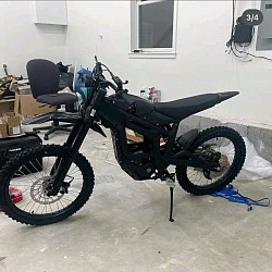 Talaria Sting R, an electric dirt bike. Key features include:  Motor: Mid-mounted IPM motor with over 6,000 watts.  Battery: 60V/45Ah battery, offering a range up to 53 miles.  Speed: Can reach speeds up to 55 mph when derestricted. Some models are restricted to 30mph for street legal use.  Legality: Not street legal in all areas due to exceeding e-bike wattage limits.  Use: Designed for off-road use but street-legal versions are available.  Brand: Talaria is inspired by the winged sandals of the Greek god Hermes.