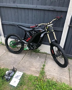 SURRON Light Bee X Electric Bike. Here's some helpful information:  It's a mix of a dirt bike and a mountain bike, powered by electricity.  It is easy to handle for beginners and exciting for experienced riders.  It can reach speeds of up to 47 mph (73 km/h).  The range is typically 40-60 miles on a full charge, but can reach 80 miles.  It weighs 47 kg plus the battery.  It has 19-inch spoke wheels with 70/100-19 CST tires.