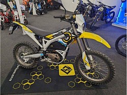Surron Storm Bee electric dirt bike. Key features include:  It is designed for off-road use.  It has a peak power of 22.5 kW and 520 Nm of torque.  The bike has a top speed of 110 km/h (68 mph) and a maximum range of 120 km (75 miles).  It does not require oil changes or gasoline, and produces no emissions or noise.  The 2023 model is priced at $8,999.  It is not street legal in most areas due to exceeding speed and power limits for electric bikes.