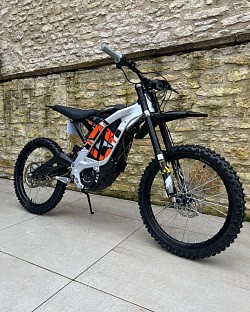 SURRON Light Bee X Electric Bike. Key features include:  Motor: 4000-6000W Top Speed: 47 mph (75 km/h) Range: Up to 80 miles on a single charge, but typically 40-60 miles depending on conditions Battery: 60V/40Ah Lithium-ion, removable Weight: 47 kg plus battery Recharge Time: Around 4 hours Part dirt bike, part mountain bike, fully electric