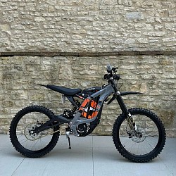 2024 SURRON Light Bee X Electric Bike. Key features include:  Type: Electric dirt bike, suitable for off-road riding. Battery: 60V removable Panasonic Lithium-ion battery. Frame: Lightweight alloy. Weight: 47 kg plus battery. Top Speed: Up to 47 mph (73 km/h), depending on load and gearing. Range: Approximately 40-80 miles on a full charge, influenced by riding conditions. Motor: Liquid-cooled, brushless electric motor. Wheels: 19-inch spoke wheels.