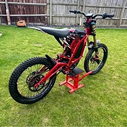 SURRON Light Bee X Electric Bike. Key features include:  Part dirt bike, part mountain bike, all electric. Peak power of 6000W (8HP). Top speed of 75 km/h (47 mph). Cruising range of 75 km (47 miles). Curb weight of 57 kg (125 lbs). Not street legal in some areas, designed primarily for off-road use. Minimum age to ride is 16 years old, but check local regulations. Some models are road legal and classified as L3E (125cc equivalent).