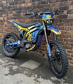 SURRON Light Bee X Electric Bike. Key features include:  Type: Electric dirt bike, blending elements of a dirt bike and mountain bike. Motor: 6kW electric motor. Battery: 60V lithium-ion. Range: Approximately 40-80 miles on a single charge, depending on conditions. Tires: Dunlop tires. Top Speed: Up to 47 mph (73 km/h), depending on load and gearing. Weight: Around 47 kg plus the battery.