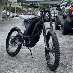 SURRON Light Bee X Electric Bike. Key features include:  Type: Part dirt bike, part mountain bike, all-electric. Mileage: Around 40-80 miles on a full charge, depending on conditions. Speed: Up to 47 mph (73 km/h), varying with load and gearing. Motor: 5000w power. Tires: 70/100-19 CST front and rear. Weight: 47 kg plus battery. Condition: Some listed for sale are new or in perfect condition.