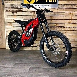 SURRON Light Bee X Electric Bike. Key features include:  Type: Electric dirt bike. Brand: SURRON. Model: Light Bee X. Motor: Electric. Battery: 60V. Range: 40-60 miles on a full charge, up to 80 miles depending on conditions. Top Speed: Up to 47 mph, can vary depending on load. Tires: CST off-road tires. Weight: 47 kg plus battery. Suspension: KKE suspension. Brakes: Twin pot hydraulic brakes. Year: 2024 or used 2022 models.
