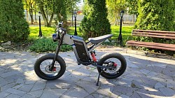 EKX X21 electric bike. Key features include:  Motor: 2000W Battery: 48V 35Ah Range: Up to 75 miles Max Speed: 34 mph Features: Fat tires, shock-absorbing fork, hydraulic disc brakes Class: It's more of an e-motorcycle than a bike